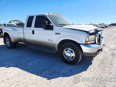 Czwarte zdjęcie samochodu z boku: 2004 FORD F350 SUPER DUTY VIN:1FTWX32P04EC22984 - miniatura