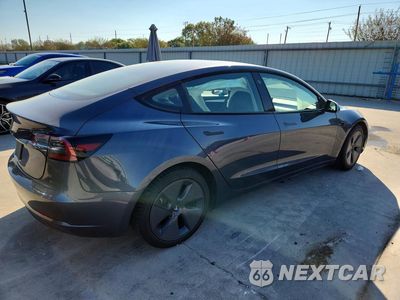 Trzecie zdjęcie samochodu z tyłu: 2023 TESLA MODEL 3 VIN:5YJ3E1EA3PF714920 - miniatura