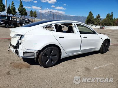 Trzecie zdjęcie samochodu z tyłu: 2023 TESLA MODEL 3 VIN:5YJ3E1EA0PF579802 - miniatura
