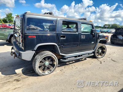 Trzecie zdjęcie samochodu z tyłu: 2003 HUMMER H2 VIN:5GRGN23UX3H101352 - miniatura