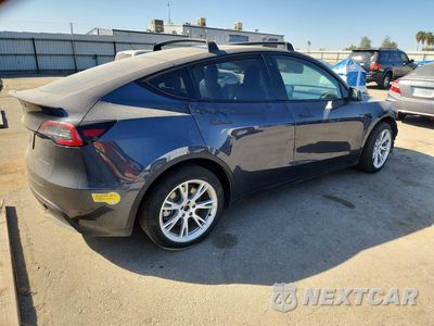 Trzecie zdjęcie samochodu z tyłu: 2022 TESLA MODEL Y VIN:7SAYGAEE4NF381906 - miniatura