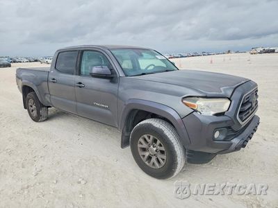 Czwarte zdjęcie samochodu z boku: 2019 TOYOTA TACOMA SR5 V6 VIN:3TMBZ5DN1KM019982 - miniatura