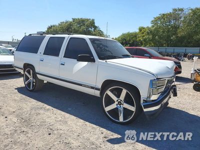 Czwarte zdjęcie samochodu z boku: 1999 GMC SUBURBAN C1500 VIN:1GKEC16R9XJ752121 - miniatura
