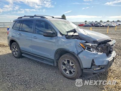 Czwarte zdjęcie samochodu z boku: 2022 HONDA PASSPORT TRAIL SPORT VIN:5FNYF8H65NB022769 - miniatura