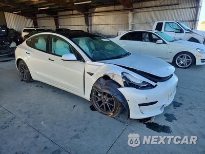 Czwarte zdjęcie samochodu z boku: 2022 TESLA MODEL 3 VIN:5YJ3E1EB0NF153646 - miniatura