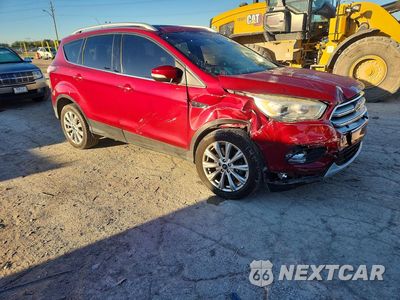 Czwarte zdjęcie samochodu z boku: 2017 FORD ESCAPE TITANIUM VIN:1FMCU0J99HUA48644 - miniatura