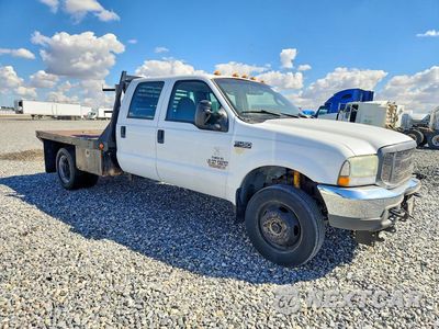 Czwarte zdjęcie samochodu z boku: 2004 FORD F450 SUPER DUTY VIN:1FDXW47P44EB73452 - miniatura