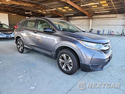 Czwarte zdjęcie samochodu z boku: 2017 HONDA CR-V LX VIN:2HKRW6H34HH214415 - miniatura