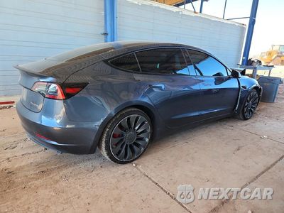 Trzecie zdjęcie samochodu z tyłu: 2023 TESLA MODEL 3 VIN:5YJ3E1EC4PF701742 - miniatura