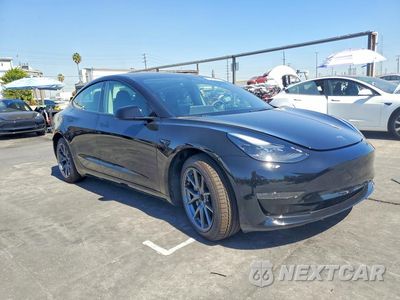 Czwarte zdjęcie samochodu z boku: 2023 TESLA MODEL 3 VIN:5YJ3E1EA2PF704184 - miniatura