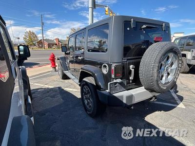 Trzecie zdjęcie samochodu z tyłu: 2014 JEEP WRANGLER UNLIMITED SAHARA VIN:1C4BJWEG2EL178982 - miniatura