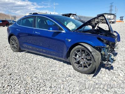 Czwarte zdjęcie samochodu z boku: 2018 TESLA MODEL 3 VIN:5YJ3E1EA7JF160711 - miniatura