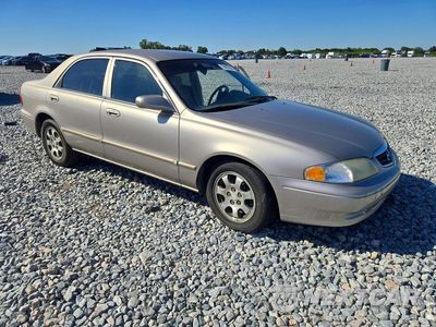 Czwarte zdjęcie samochodu z boku: 2002 MAZDA 626 LX VIN:1YVGF22C025302565 - miniatura
