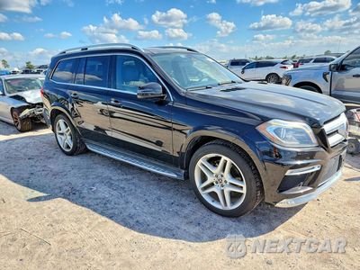 Czwarte zdjęcie samochodu z boku: 2014 MERCEDES-BENZ GL 550 4MATIC VIN:4JGDF7DE0EA423849 - miniatura