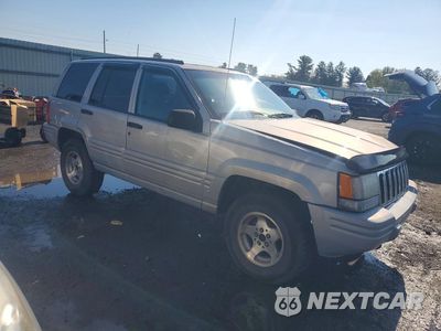 Czwarte zdjęcie samochodu z boku: 1998 JEEP GRAND CHEROKEE LAREDO VIN:1J4GZ48S5WC274524 - miniatura