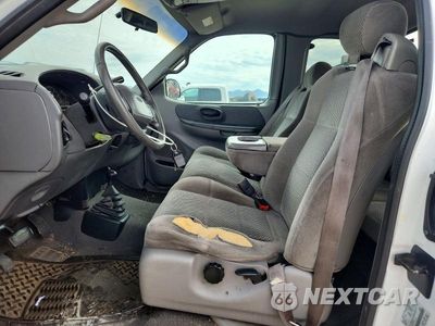 Zdjęcie 7 z 12 samochodu: 2001 FORD F150 VIN:1FTRX18W31NA50445 - miniatura