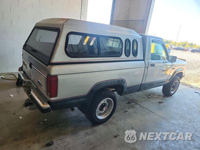 Trzecie zdjęcie samochodu z tyłu: 1989 FORD RANGER VIN:1FTCR11T6KUC21552 - miniatura