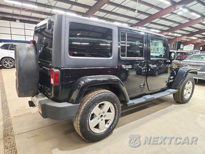 Trzecie zdjęcie samochodu z tyłu: 2012 JEEP WRANGLER UNLIMITED SAHARA VIN:1C4BJWEG8CL245825 - miniatura