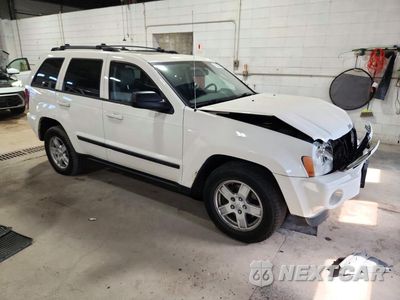 Czwarte zdjęcie samochodu z boku: 2007 JEEP GRAND CHEROKEE LAREDO VIN:1J8HR48P47C631112 - miniatura