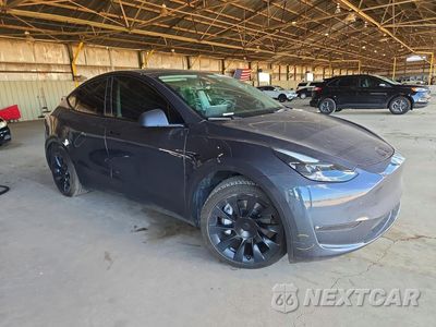 Czwarte zdjęcie samochodu z boku: 2023 TESLA MODEL Y VIN:7SAYGAEE2PF704157 - miniatura