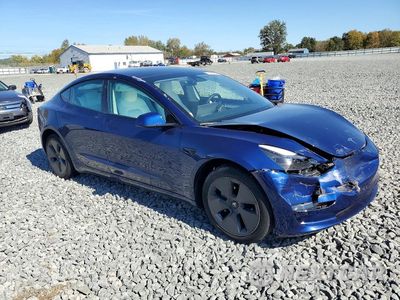 Czwarte zdjęcie samochodu z boku: 2023 TESLA MODEL 3 VIN:5YJ3E1EA3PF603123 - miniatura