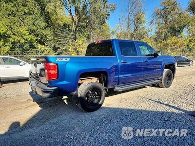 Trzecie zdjęcie samochodu z tyłu: 2017 CHEVROLET SILVERADO K1500 LT VIN:3GCUKREC9HG424559 - miniatura