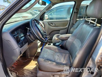 Zdjęcie 7 z 13 samochodu: 2002 MAZDA TRIBUTE LX VIN:4F2YU09122KM56589 - miniatura