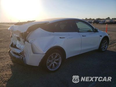 Trzecie zdjęcie samochodu z tyłu: 2023 TESLA MODEL Y VIN:7SAYGAEE7PF979703 - miniatura
