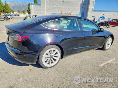 Trzecie zdjęcie samochodu z tyłu: 2022 TESLA MODEL 3 VIN:5YJ3E1EB5NF185069 - miniatura