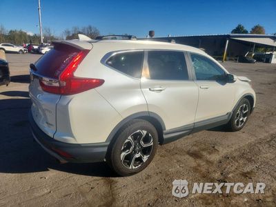 Trzecie zdjęcie samochodu z tyłu: 2017 HONDA CR-V TOURING VIN:2HKRW2H96HH616224 - miniatura