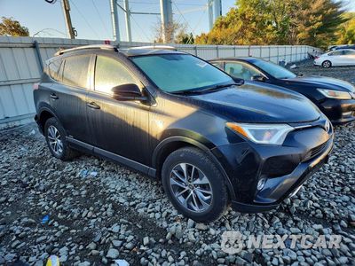 Czwarte zdjęcie samochodu z boku: 2016 TOYOTA RAV4 HV XLE VIN:JTMRJREV2GD011226 - miniatura