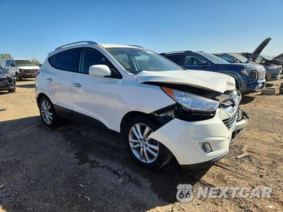 Czwarte zdjęcie samochodu z boku: 2011 HYUNDAI TUCSON LIMITED VIN:KM8JUCAC2BU292101 - miniatura