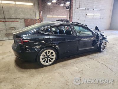 Trzecie zdjęcie samochodu z tyłu: 2022 TESLA MODEL 3 VIN:5YJ3E1EB9NF290603 - miniatura