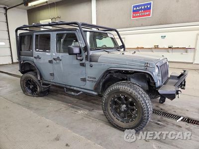 Czwarte zdjęcie samochodu z boku: 2014 JEEP WRANGLER UNLIMITED SPORT VIN:1C4BJWDG1EL158563 - miniatura
