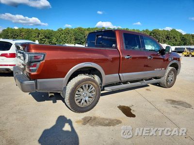 Trzecie zdjęcie samochodu z tyłu: 2017 NISSAN TITAN XD PLATINUM RESERVE VIN:1N6BA1F40HN548548 - miniatura