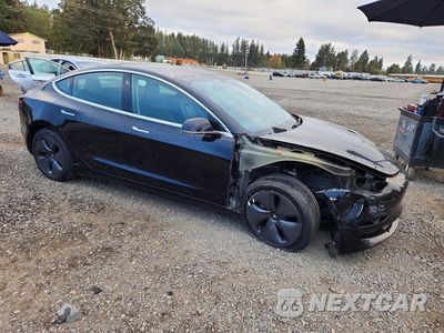 Czwarte zdjęcie samochodu z boku: 2019 TESLA MODEL 3 VIN:5YJ3E1EA0KF425728 - miniatura