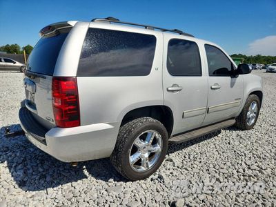 Trzecie zdjęcie samochodu z tyłu: 2011 CHEVROLET TAHOE C1500 LT VIN:1GNSCBE05BR112464 - miniatura
