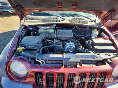 Zdjęcie 12 z 13 samochodu: 2003 JEEP LIBERTY SPORT VIN:1J4GL48K03W607336 - miniatura