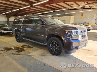 Czwarte zdjęcie samochodu z boku: 2015 CHEVROLET SUBURBAN K1500 LT VIN:1GNSKJKC9FR739377 - miniatura