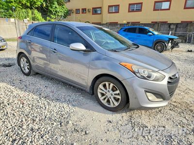 Czwarte zdjęcie samochodu z boku: 2014 HYUNDAI ELANTRA GT BASE VIN:KMHD35LH3EU215004 - miniatura