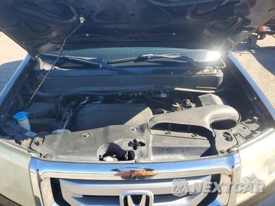 Zdjęcie 11 z 12 samochodu: 2011 HONDA PILOT EX VIN:5FNYF4H49BB073002 - miniatura