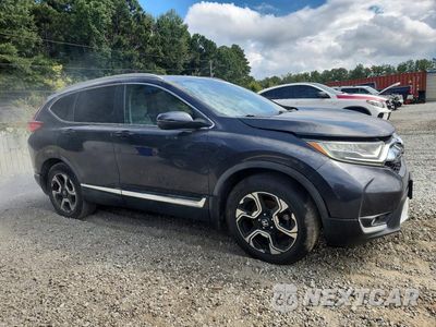 Czwarte zdjęcie samochodu z boku: 2017 HONDA CR-V TOURING VIN:7FARW1H99HE033322 - miniatura