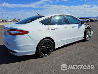 Trzecie zdjęcie samochodu z tyłu: 2016 FORD FUSION SE VIN:3FA6P0H77GR343184 - miniatura
