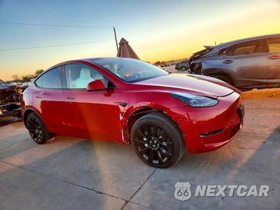 Czwarte zdjęcie samochodu z boku: 2023 TESLA MODEL Y VIN:7SAYGAEE4PF642485 - miniatura