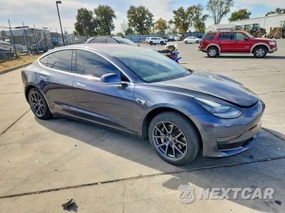 Czwarte zdjęcie samochodu z boku: 2017 TESLA MODEL 3 VIN:5YJ3E1EA9HF000663 - miniatura