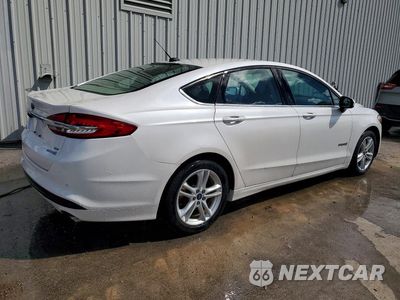 Trzecie zdjęcie samochodu z tyłu: 2018 FORD FUSION SE HYBRID VIN:3FA6P0LUXJR140827 - miniatura