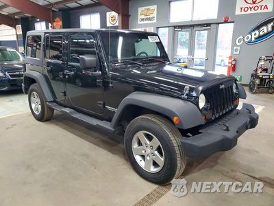 Czwarte zdjęcie samochodu z boku: 2012 JEEP WRANGLER UNLIMITED RUBICON VIN:1C4BJWFGXCL108514 - miniatura