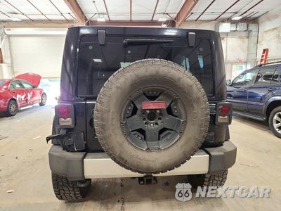 Zdjęcie 6 z 13 samochodu: 2012 JEEP WRANGLER UNLIMITED SAHARA VIN:1C4HJWEG4CL240891 - miniatura