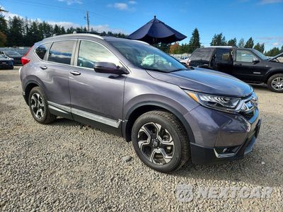 Czwarte zdjęcie samochodu z boku: 2017 HONDA CR-V TOURING VIN:2HKRW2H91HH612484 - miniatura