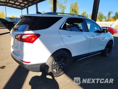 Trzecie zdjęcie samochodu z tyłu: 2021 CHEVROLET EQUINOX LT VIN:3GNAXUEVXMS181299 - miniatura